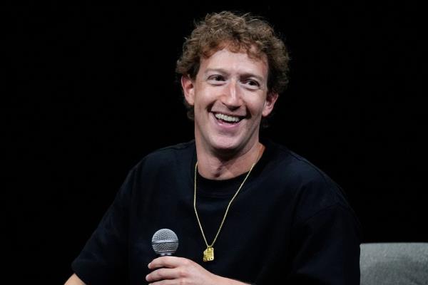 Mark Zuckerberg, CEO of meta, speaking at the SIGGRAPH 2024 conference with a microphone