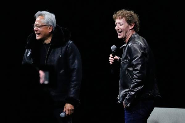 Nvidia CEO Jensen Huang laughing with meta CEO Mark Zuckerberg on stage at SIGGRAPH 2024 after exchanging jackets